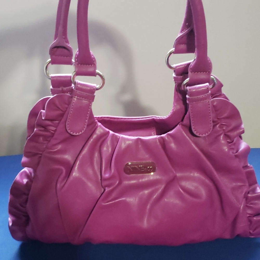 Nine & Co purple purse with ruffle detail